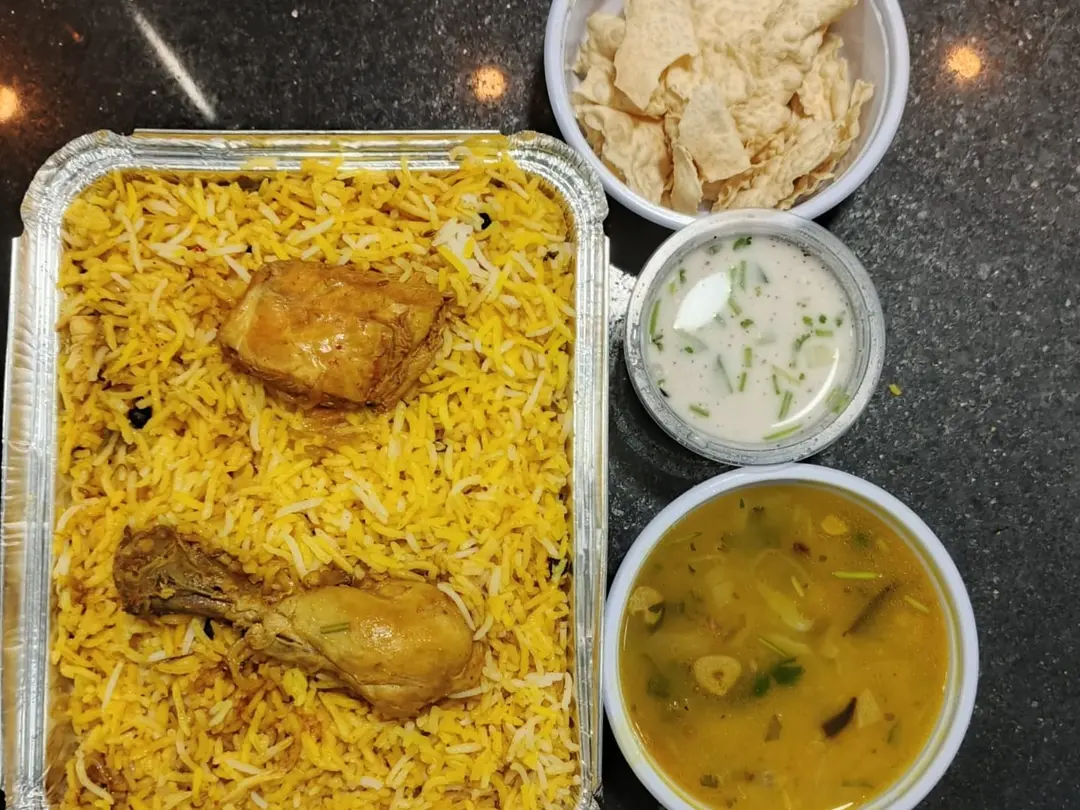 Chicken Biryani with Raita and Dal
